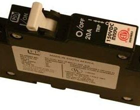 Close-up of a 20A DC circuit breaker, rated for 150V DC, featuring an on/off switch and labeling with technical specifications.