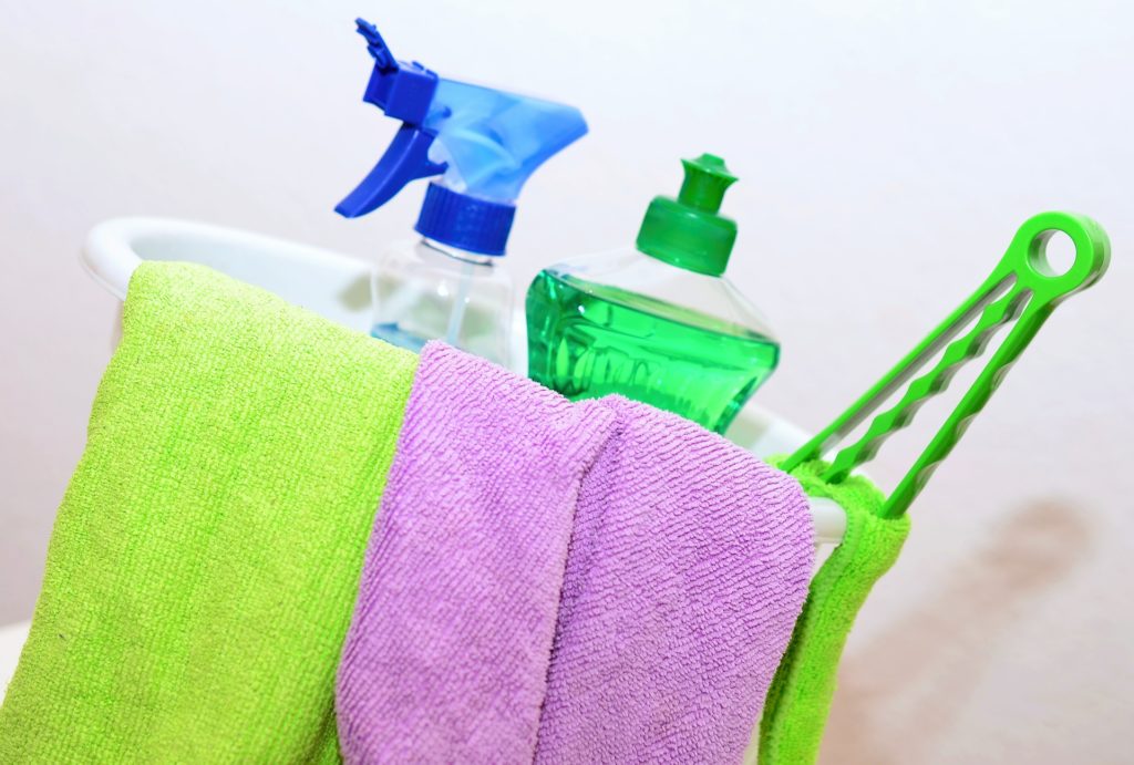 cleaning supplies in a basket
